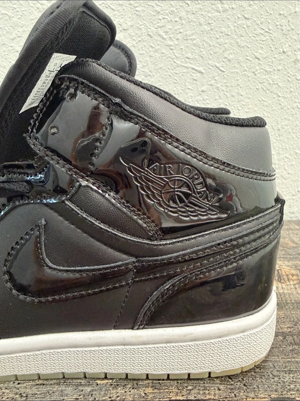Jordan Black Patent Leather High-Top Sneakers with Purple Logo